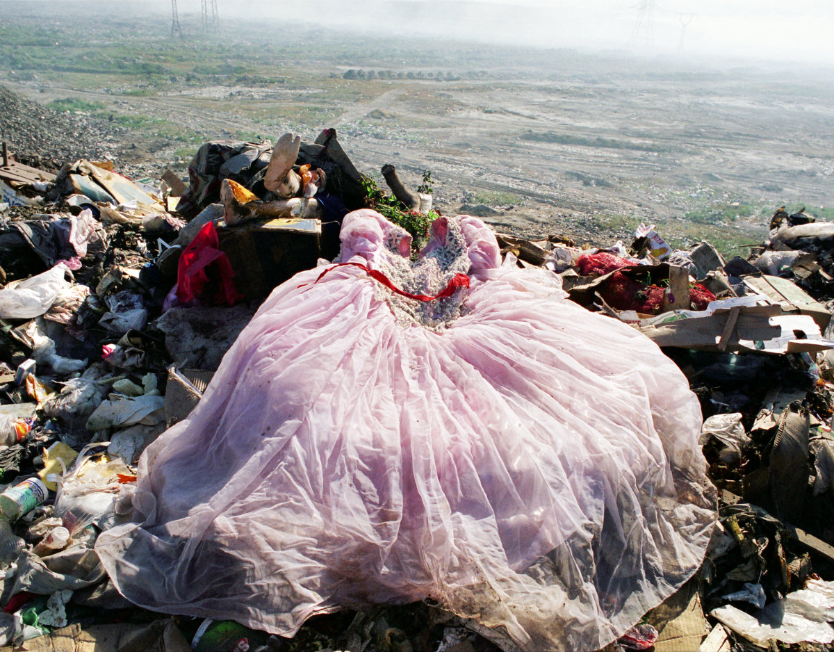 Wedding dress on a city dump.